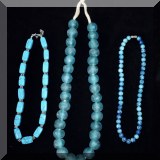 J01. Turquoise colored costume necklaces. 